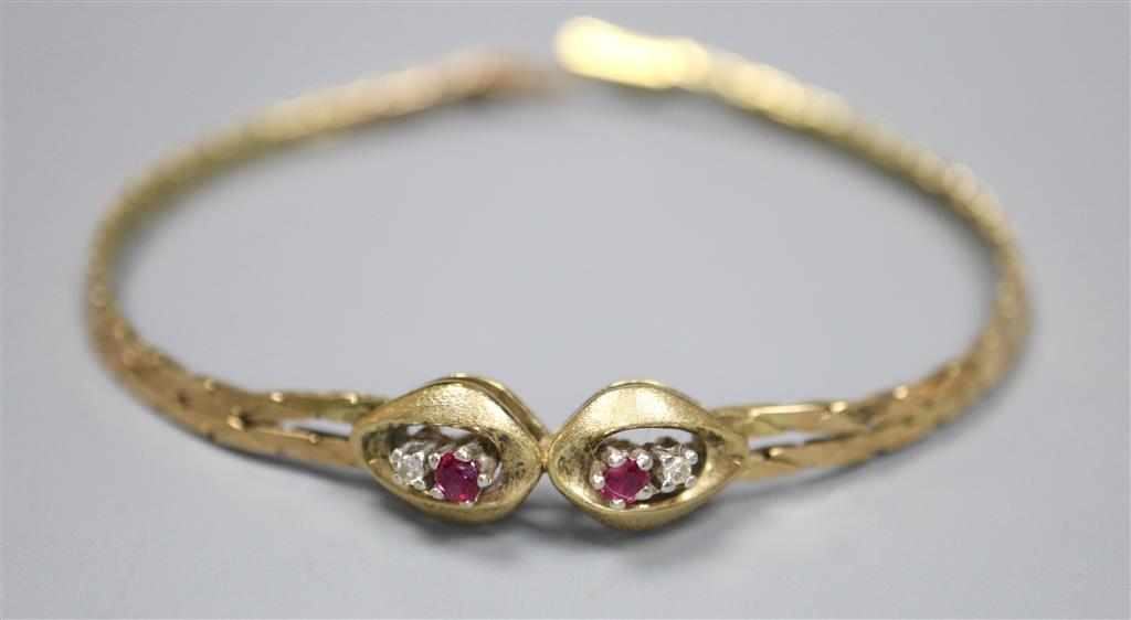 A modern 9ct, two stone ruby and two stone diamond set bracelet, 18cm,